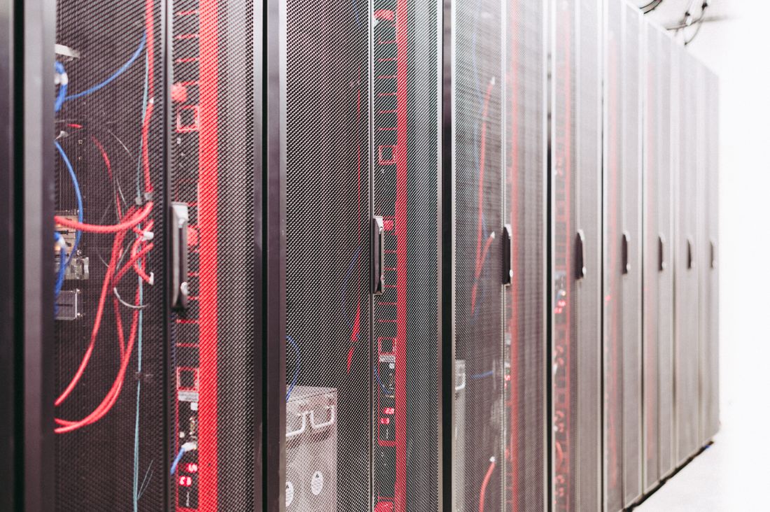 Row of datacenter racks with structured cabling